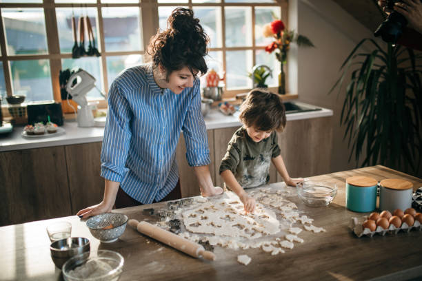 Mom and son making cookies together