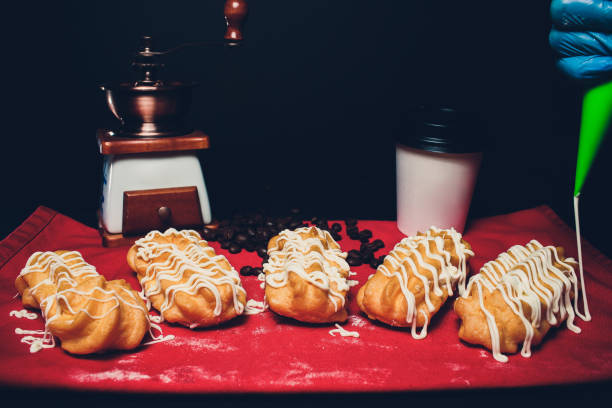 Eclairs french dessert on a wooden table