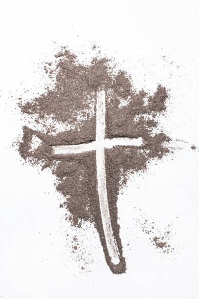 istock Cross and ash on white background - symbol of Ash Wednesday. Copy space 1133083199