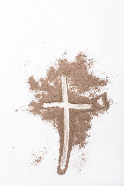 istock Cross and ash on white background - symbol of Ash Wednesday. Copy space 1133083266