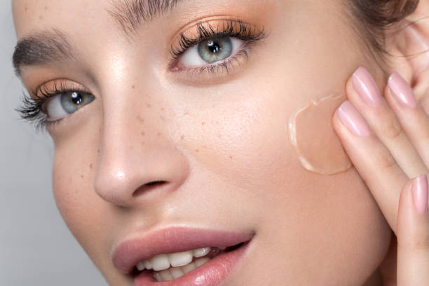 istock Young woman with perfect skin applying foundation 1133083352