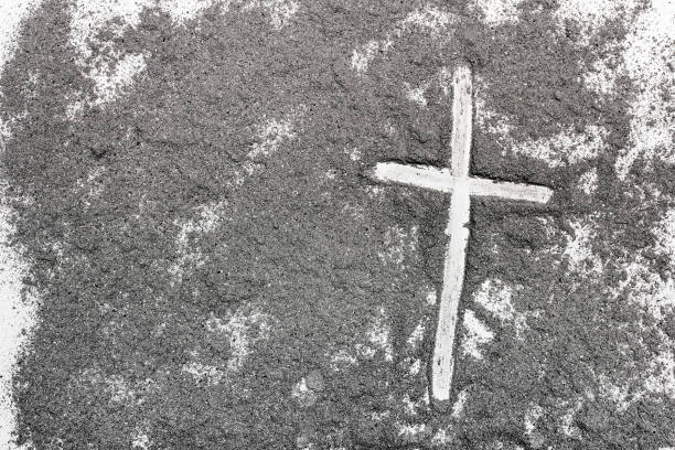 istock Cross and ash on white background - symbol of Ash Wednesday. Copy space 1133083903