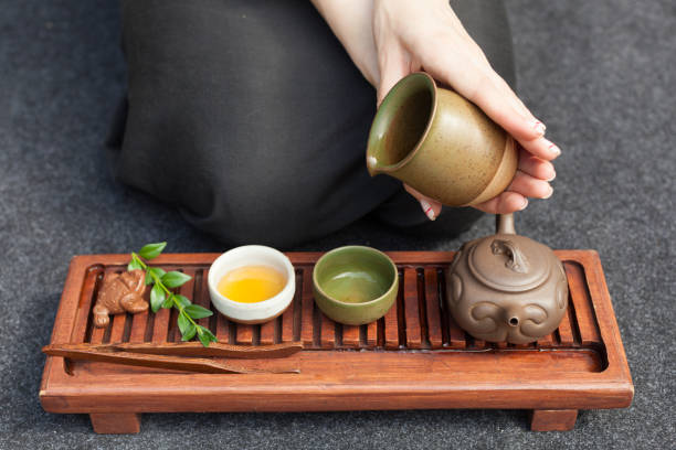 istock Traditional tea ceremony close up with woman hand 1133083953