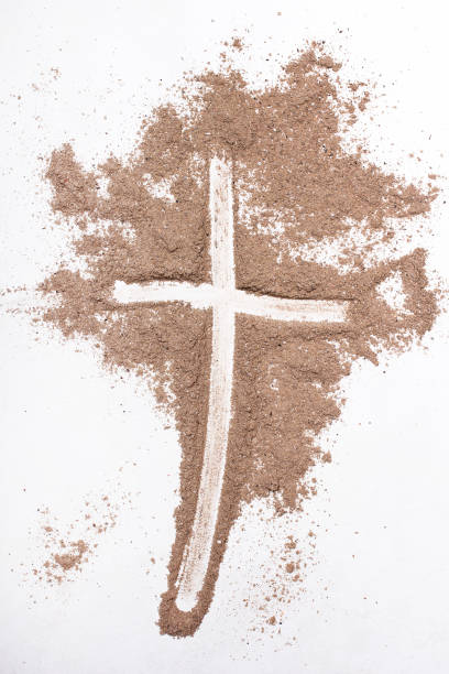 istock Cross and ash on white background - symbol of Ash Wednesday. Copy space 1133084007