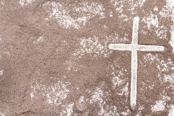 istock Cross and ash on white background - symbol of Ash Wednesday. Copy space 1133084140