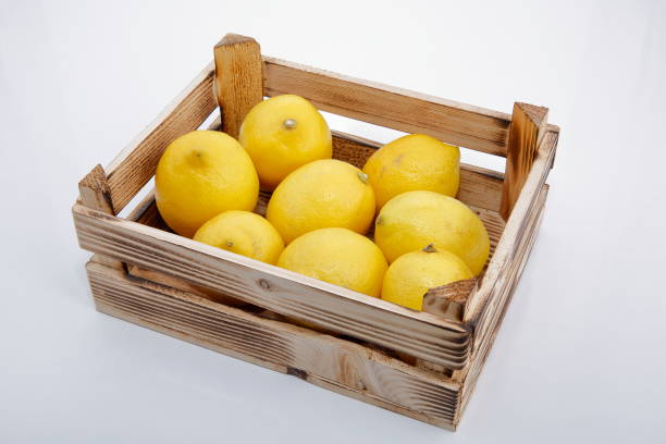 istock Fresh lemons in wooden crate. 1133088400