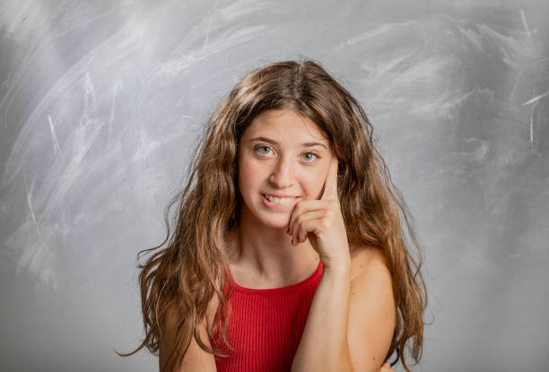 istock Blonde girl emotion and gesture portrait in studio thinking 1133089017
