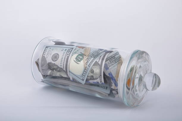 istock Composition of american dollars in glass jar. 1133089091