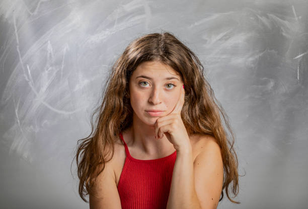 istock Blonde girl emotion and gesture portrait in studio thinking bored 1133089882