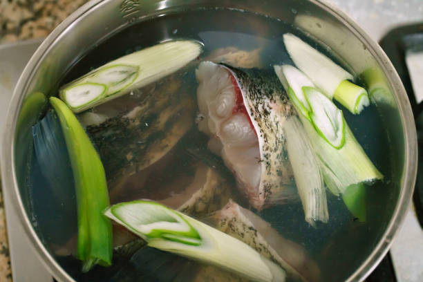 Cooking fish in a pan Cooking fish in a pan 鹹水魚 stock pictures, royalty-free photos & images