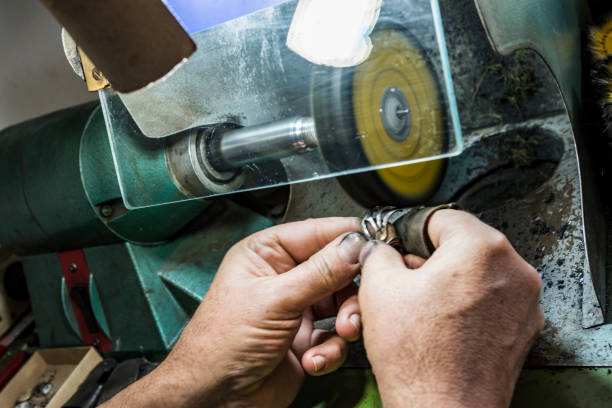 istock hands of jewelry technician 1133094492