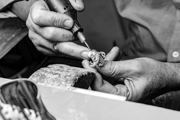istock hands of jewelry technician 1133097097