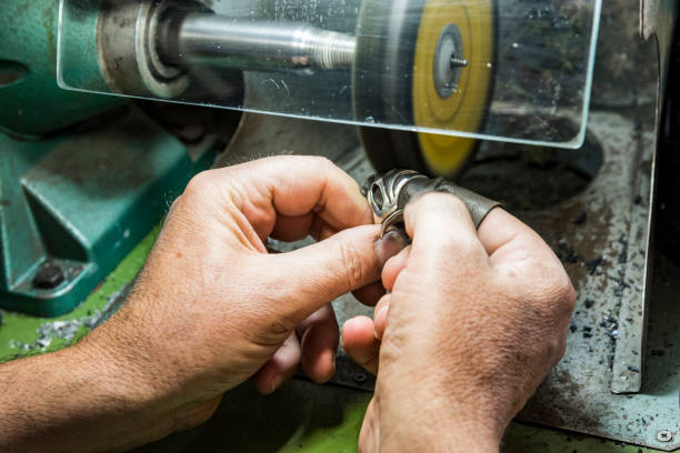 istock hands of jewelry technician 1133097914