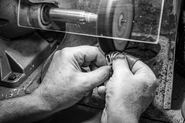 istock hands of jewelry technician 1133097918