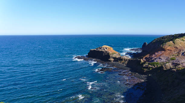 istock Peaceful sea with rocks on shore 1133104571
