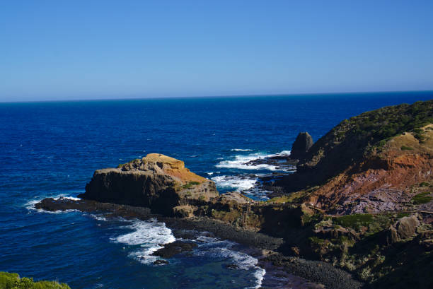 istock Peaceful sea with rocks on shore 1133105302