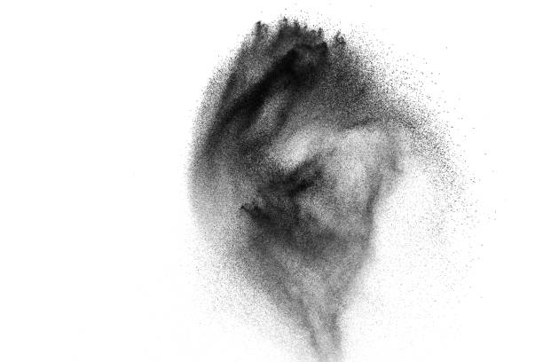 istock Black powder explosion against white background. Charcoal dust particles exhale in the air. 1133106112