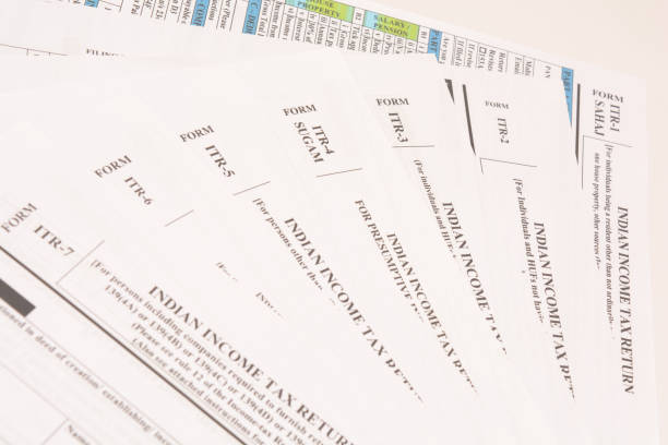 istock Different types of Indian income tax return forms on isolated background. 1133108582