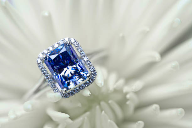 istock Sapphire Engagement Ring on White Flower 1133110174
