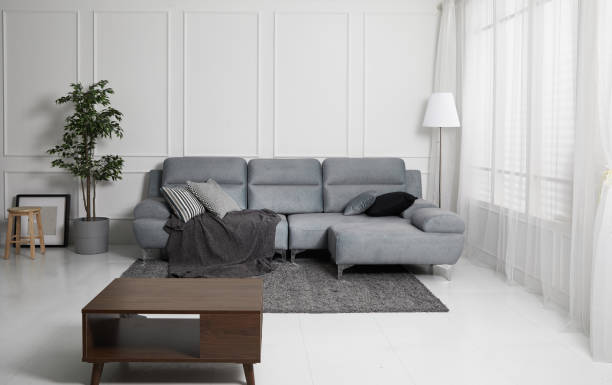 istock Scandinavian style livingroom with fabric sofa, sofa table. morning image with plant. sofa table on the lug. 1133112709