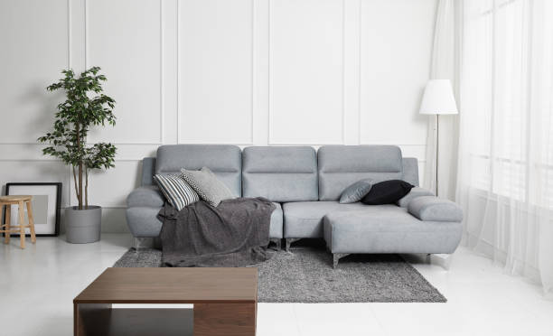 istock Scandinavian style livingroom with fabric sofa, sofa table. morning image with plant. sofa table on the lug. 1133112755