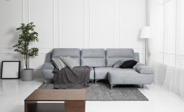 istock Scandinavian style livingroom with fabric sofa, sofa table. morning image with plant. sofa table on the lug. 1133113670