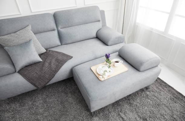 istock Scandinavian style livingroom with fabric sofa, sofa table. morning image with plant. sofa table on the lug. 1133113673