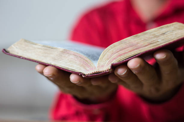 istock Man reading the Holy Bible. book 1133115335