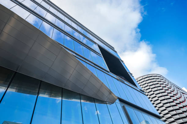istock Window glass, Modern architecture in the blue sky white cloud city 1133118018