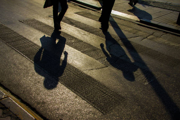 istock Shadows and pedestrian crossing 1133118937