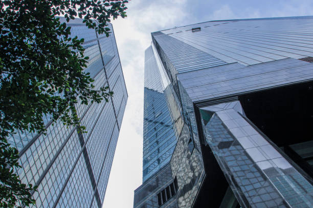istock Window glass, Modern architecture in the blue sky white cloud city 1133121552