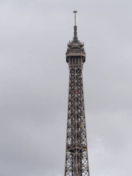 istock The upper part of the Eiffel Tower in overcast weather 1133122277