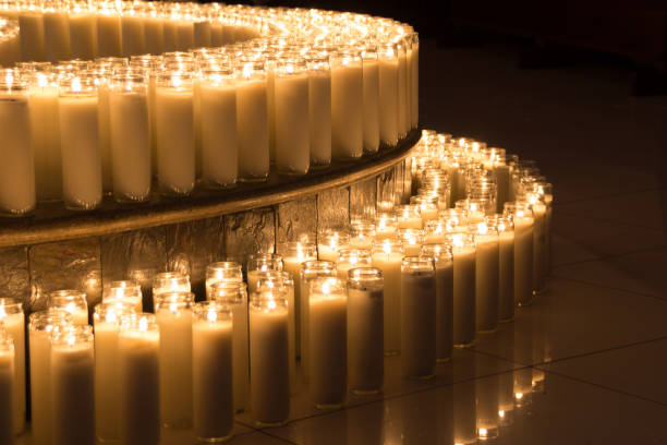 istock Lighted wax candles photograph 1133122345