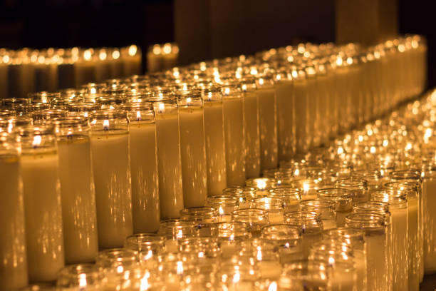 istock Lighted wax candles photograph 1133122549