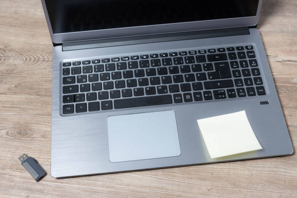 istock Top view of a laptop on a wooden table 1133122706