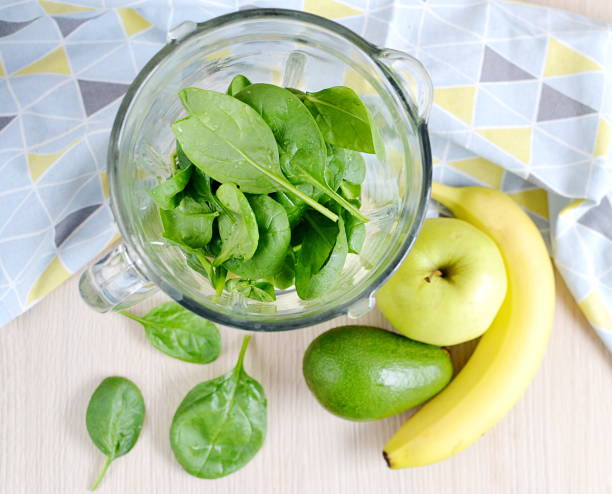istock Green spinach smoothies with fruits 1133123478
