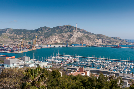 Cartagena, Spain - April 12, 2017: Views of the commercial harbor and touristic dock of Cartagena, in the province of Murcia, Spain.