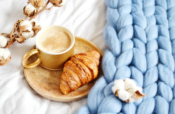 istock Cup with cappuccino, croissant, blue pastel giant blanket 1133125681