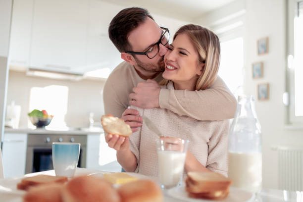 istock Happy couple having breakfast together in the kitchen 1133126051
