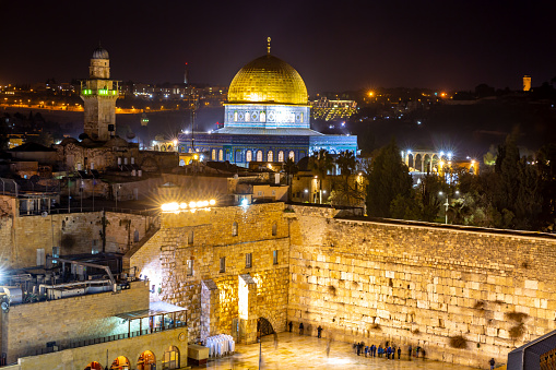 This pic shows  illuminated night view of  the  Old City of Jerusalem and western wall in israel. The pic is taken at night time and lights can been seen in the pic. The pic is taken in January 2019
