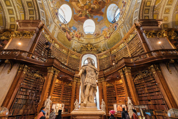 kaiser karl vi. statue in hofburg-bibliothek - palace vienna indoors museum stock-fotos und bilder