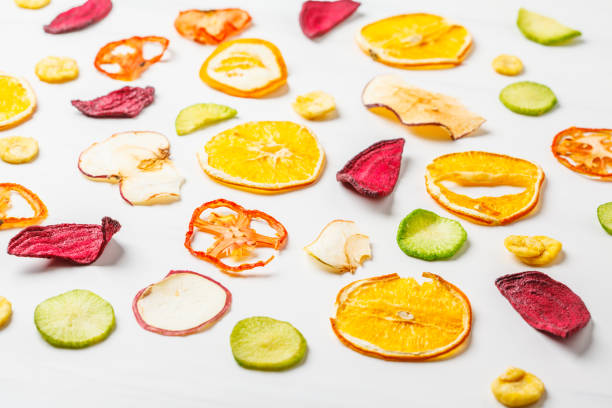 Dried vegetables and fruits on a white background. Plant based food concept.