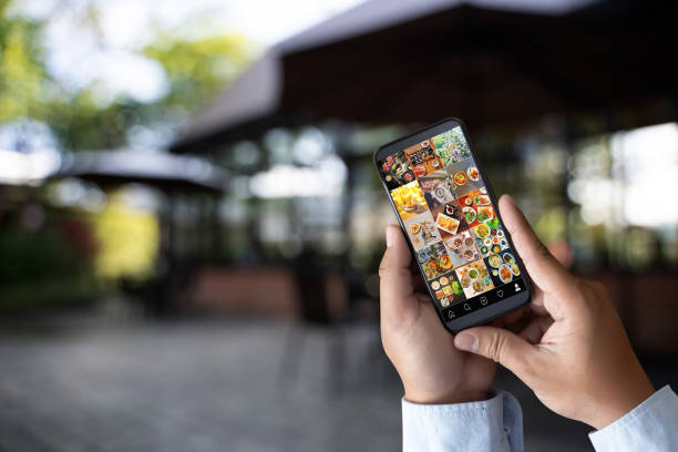 istock man looking phone publicly shared photo on social network 1133132743