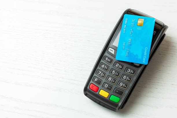 istock POS terminal, Payment Machine with credit card isolated on white background. Contactless payment with NFC technology. 1133134400
