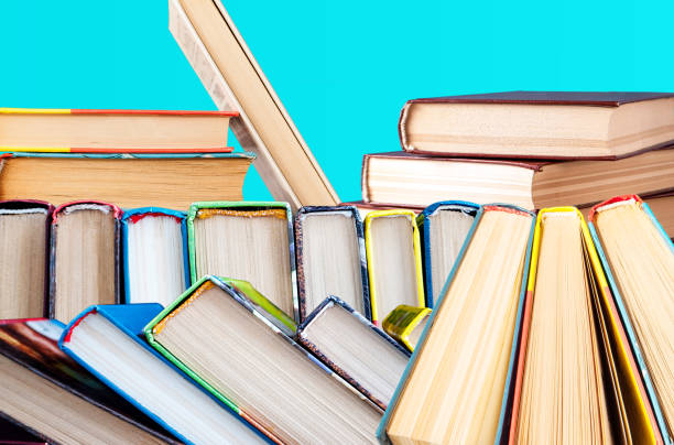istock books on a blue background stacked folded, lay with a slope 1133134698