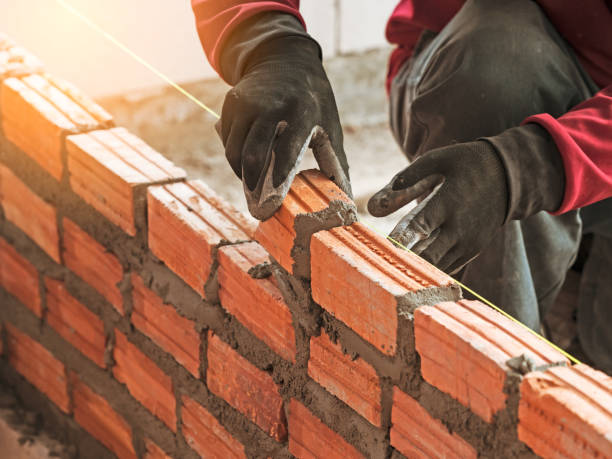 istock Worker were bricklayer at wall in house 1133135731