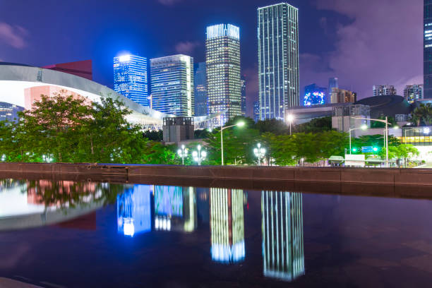 istock Tall buildings and reflections by the water at night 1133135918