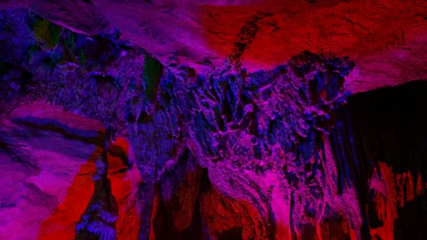 istock beautiful illuminated multicolored stalactites from karst Reed Flute cave In the cave. Guilin Guangxi China 1133140897