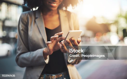 istock Making big plans on her cellphone 1133141435