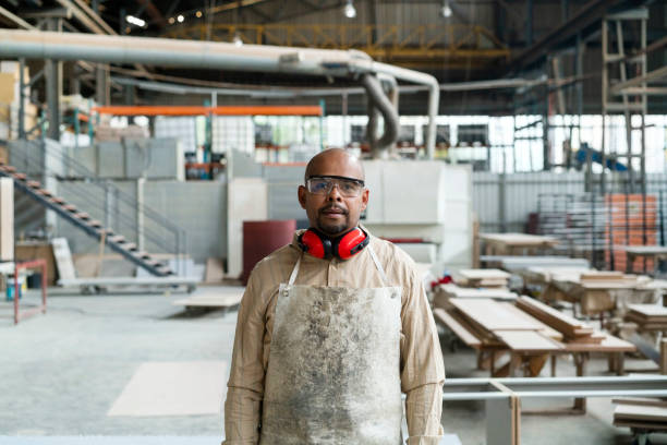 istock Portrait of bald carpenter standing in workshop 1133142433